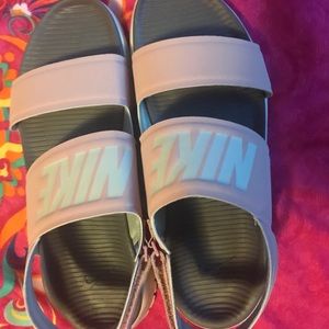 Light pink and white Nike sandals